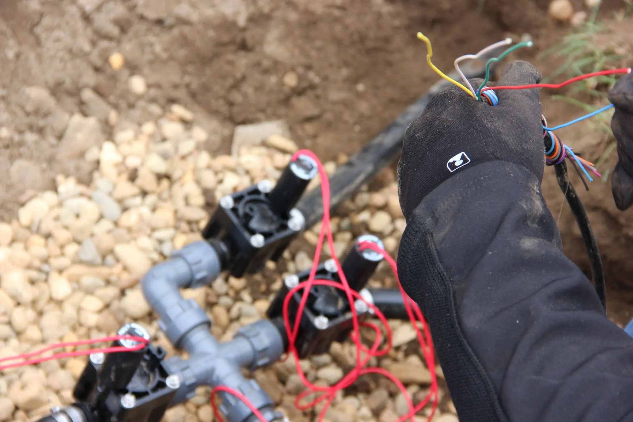 technician wiring irrigation valves