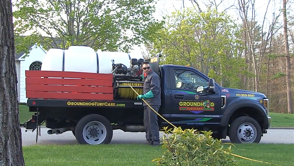 Groundhog Turf Care technician treating lawn