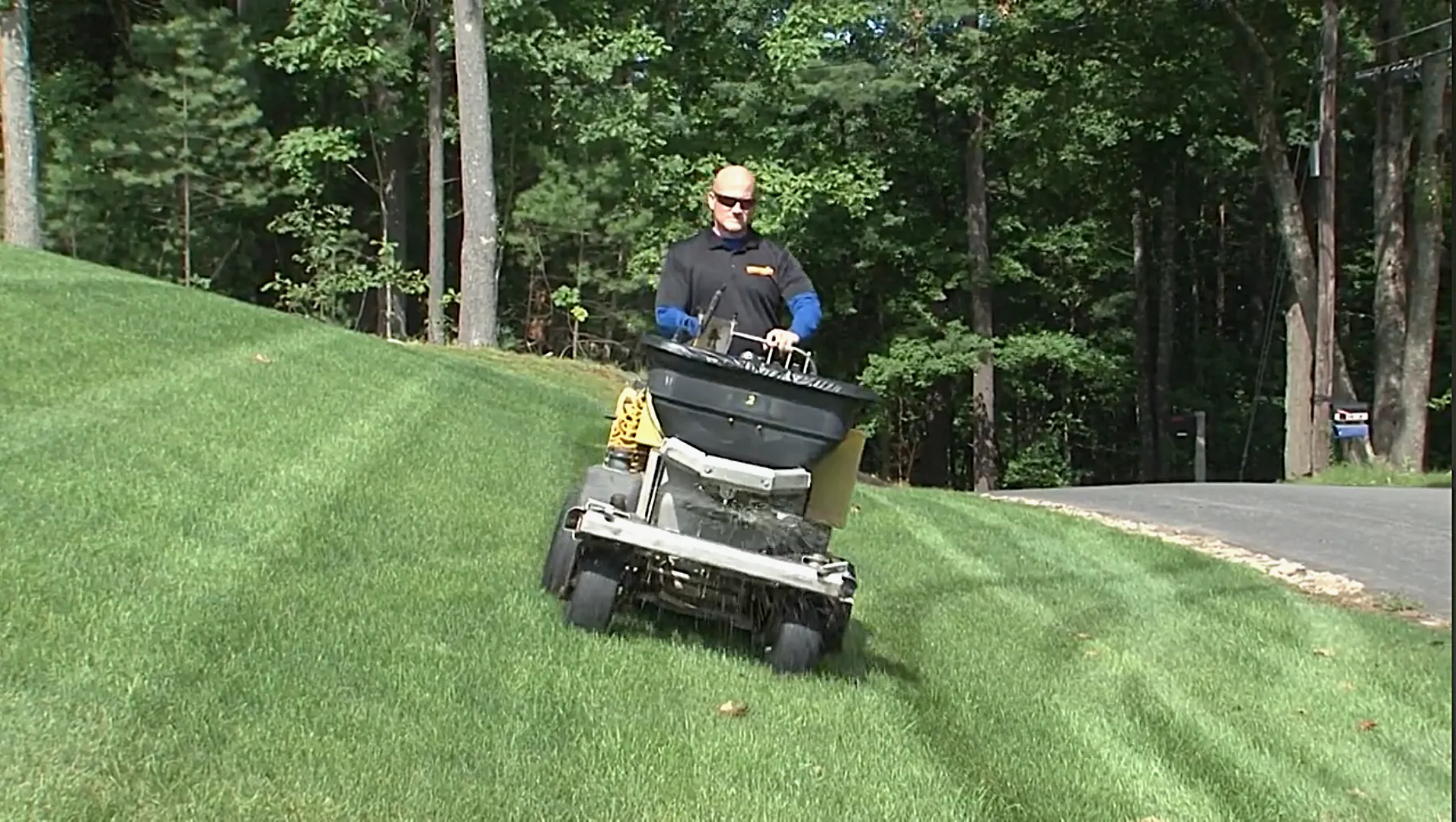 lawn care technician applying fertilizer
